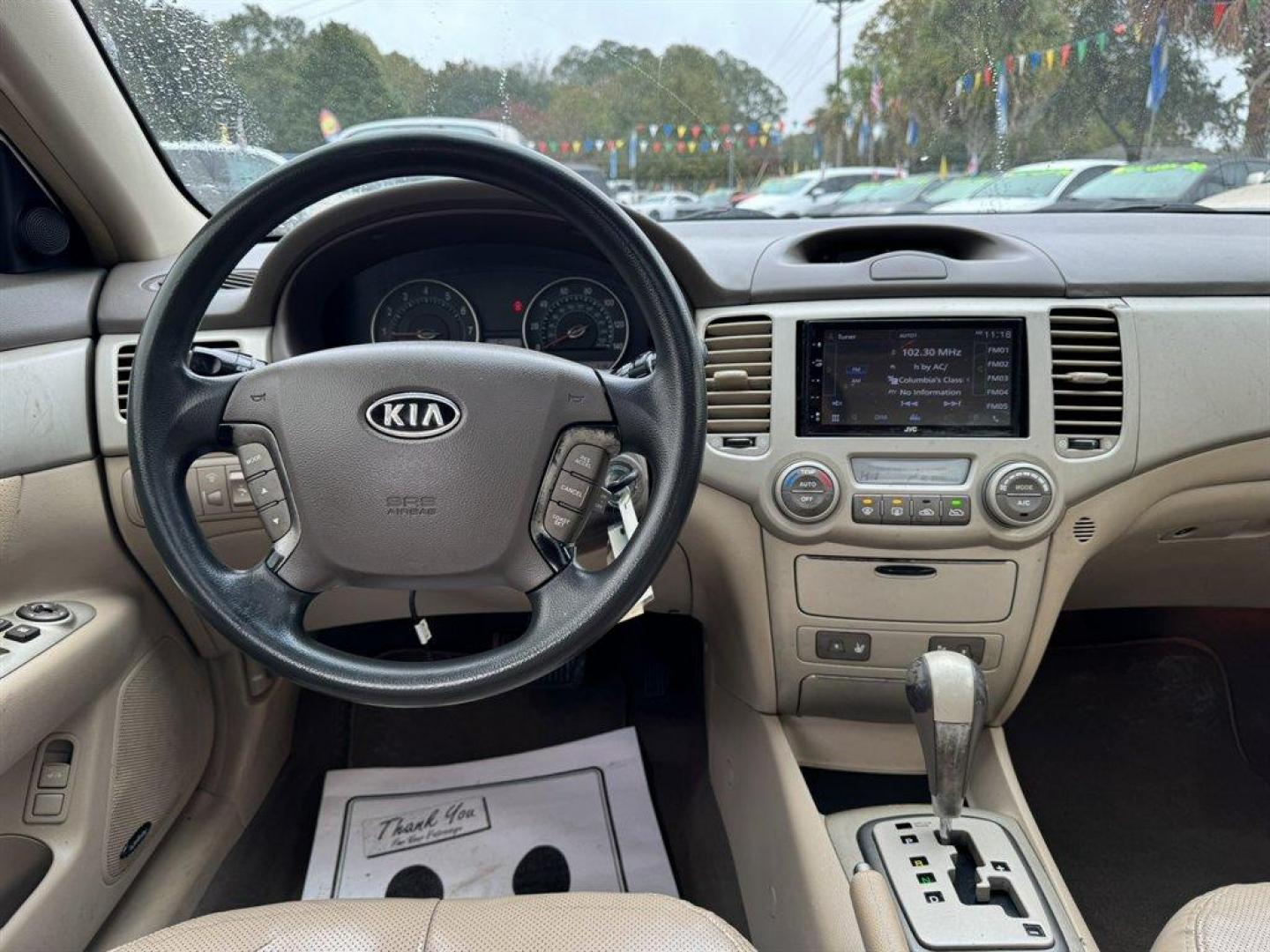 2008 White /Taupe Kia Optima (KNAGE124585) with an 2.7l V6 MPI Dohc 2.7l engine, Automatic transmission, located at 745 East Steele Rd., West Columbia, SC, 29170, (803) 755-9148, 33.927212, -81.148483 - Special Internet Price! 2008 Kia Optima - Photo#6