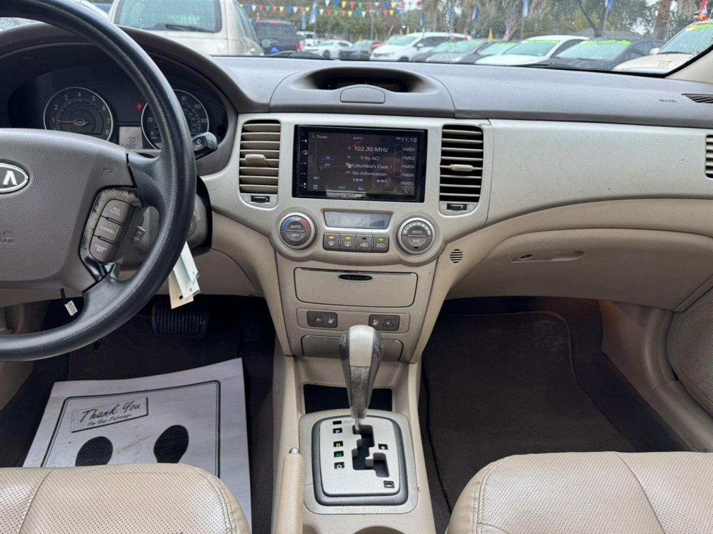 2008 White /Taupe Kia Optima (KNAGE124585) with an 2.7l V6 MPI Dohc 2.7l engine, Automatic transmission, located at 745 East Steele Rd., West Columbia, SC, 29170, (803) 755-9148, 33.927212, -81.148483 - Special Internet Price! 2008 Kia Optima - Photo#11