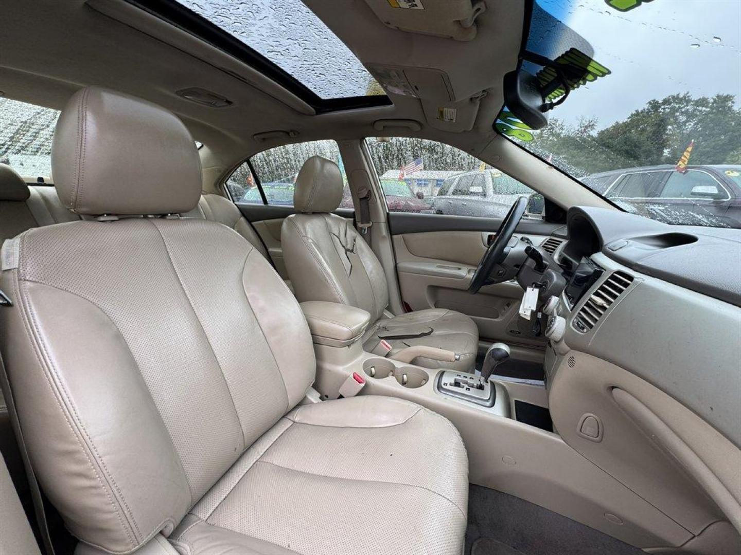 2008 White /Taupe Kia Optima (KNAGE124585) with an 2.7l V6 MPI Dohc 2.7l engine, Automatic transmission, located at 745 East Steele Rd., West Columbia, SC, 29170, (803) 755-9148, 33.927212, -81.148483 - Special Internet Price! 2008 Kia Optima - Photo#24