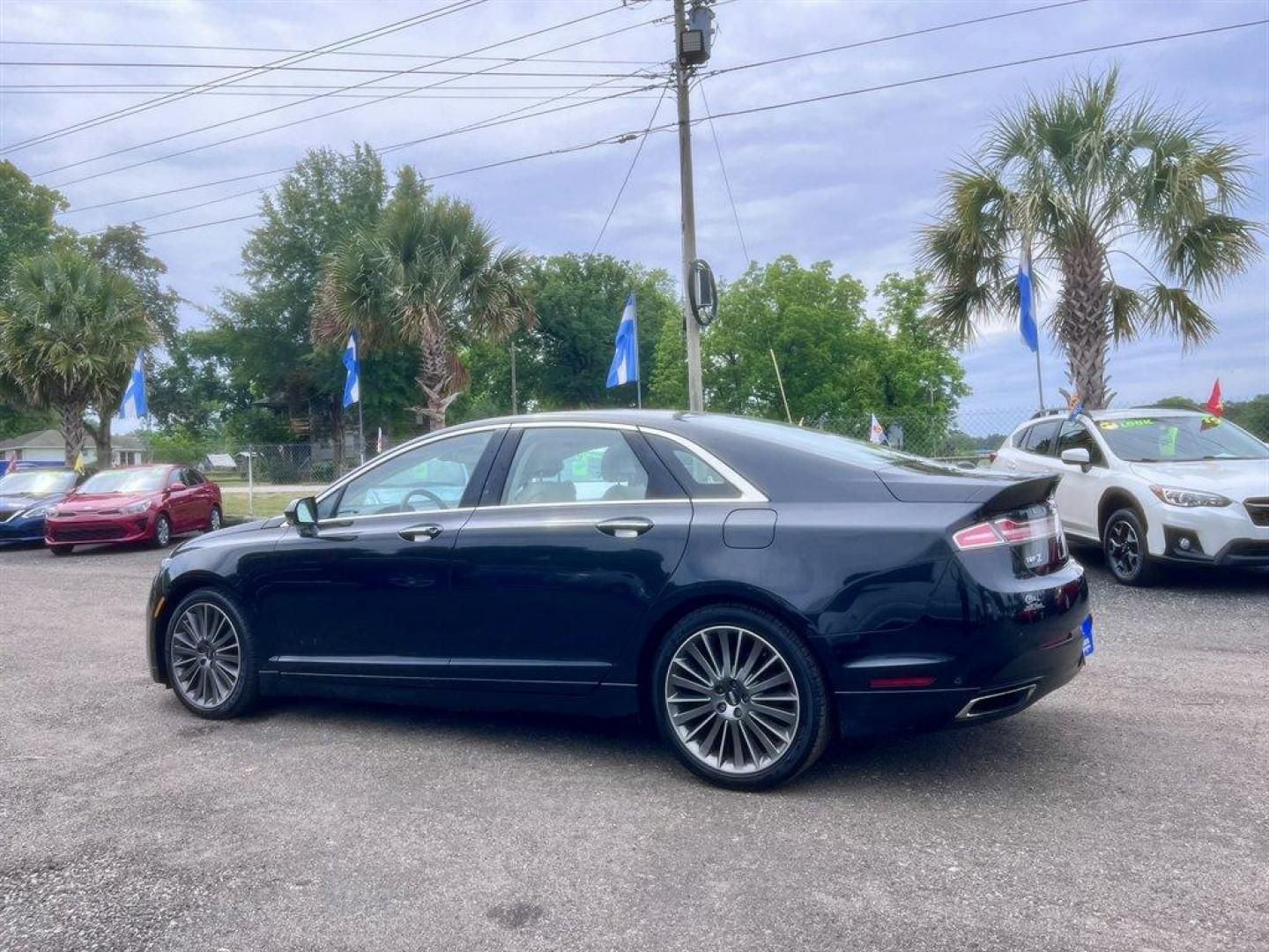 2014 Black /Taupe Lincoln MKZ (3LN6L2G93ER) with an 2.0l I-4 DI T/C Ecoboost engine, Automatic transmission, located at 745 East Steele Rd., West Columbia, SC, 29170, (803) 755-9148, 33.927212, -81.148483 - Special Internet Price! 2014 Lincoln MKZ with AM/FM radio, Bluetooth for phone, Navigation, Cruise control, Sunroof, Keyless entry, Push to start, Leather interior, Powered windows, Powered door locks, Plus more! - Photo#5