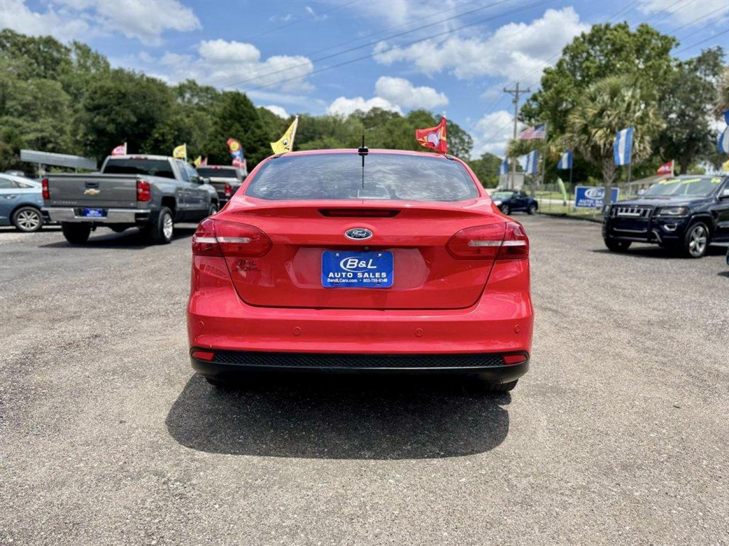 2016 Red /Black Ford Focus (1FADP3F24GL) with an 2.0l I-4 DI Dohc Flex 2.0 engine, Automatic transmission, located at 745 East Steele Rd., West Columbia, SC, 29170, (803) 755-9148, 33.927212, -81.148483 - Special Internet Price! 2016 Ford Focus with AM/FM radio, Backup camera, Navigation, Cruise control, Sunroof, Leather interior, Powered driver seat, Powered windows, Powered door locks, Plus more! - Photo#4