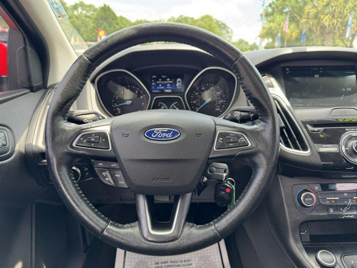 2016 Red /Black Ford Focus (1FADP3F24GL) with an 2.0l I-4 DI Dohc Flex 2.0 engine, Automatic transmission, located at 745 East Steele Rd., West Columbia, SC, 29170, (803) 755-9148, 33.927212, -81.148483 - Special Internet Price! 2016 Ford Focus with AM/FM radio, Backup camera, Navigation, Cruise control, Sunroof, Leather interior, Powered driver seat, Powered windows, Powered door locks, Plus more! - Photo#7