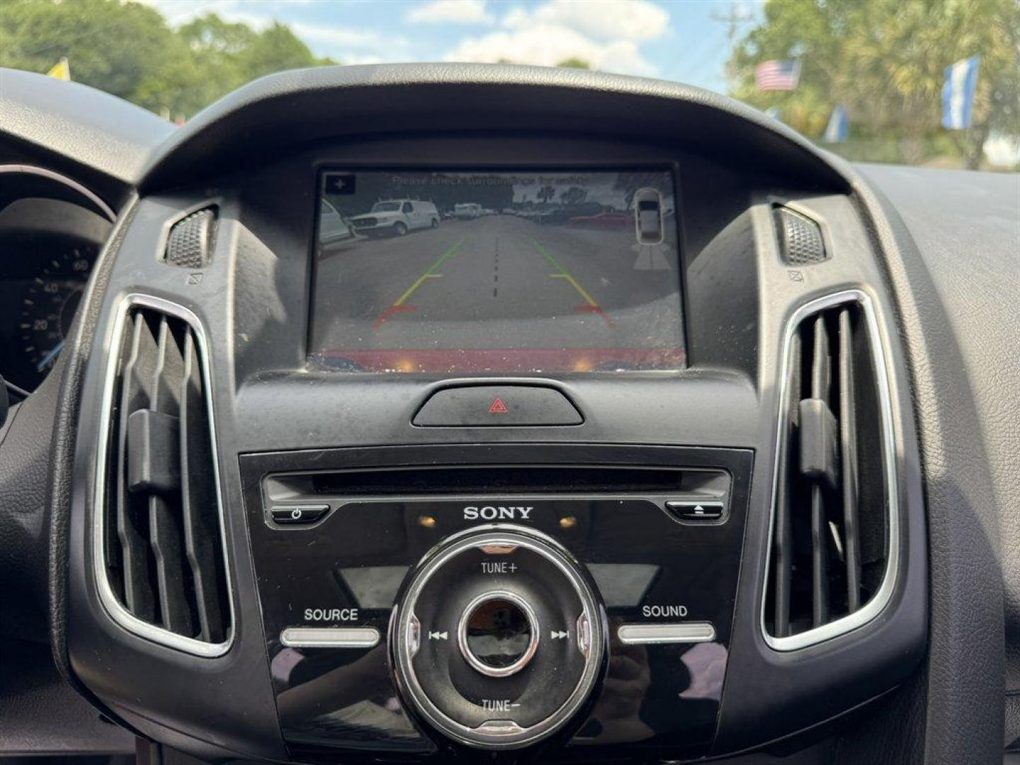 2016 Red /Black Ford Focus (1FADP3F24GL) with an 2.0l I-4 DI Dohc Flex 2.0 engine, Automatic transmission, located at 745 East Steele Rd., West Columbia, SC, 29170, (803) 755-9148, 33.927212, -81.148483 - Special Internet Price! 2016 Ford Focus with AM/FM radio, Backup camera, Navigation, Cruise control, Sunroof, Leather interior, Powered driver seat, Powered windows, Powered door locks, Plus more! - Photo#12