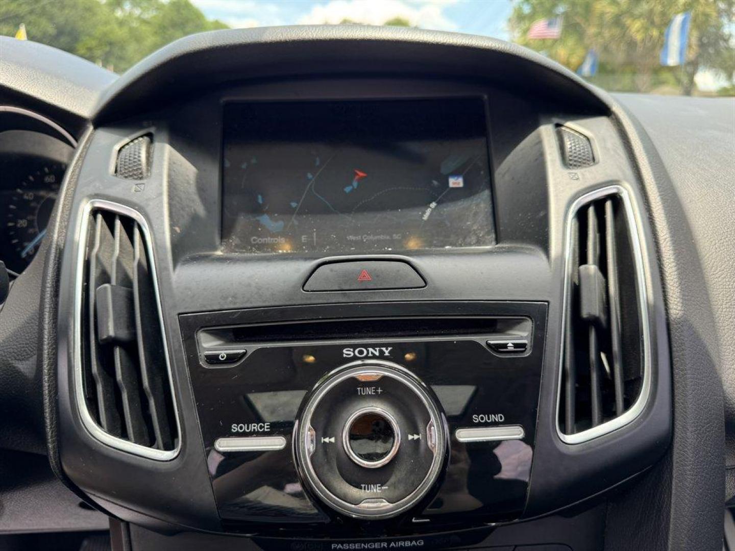 2016 Red /Black Ford Focus (1FADP3F24GL) with an 2.0l I-4 DI Dohc Flex 2.0 engine, Automatic transmission, located at 745 East Steele Rd., West Columbia, SC, 29170, (803) 755-9148, 33.927212, -81.148483 - Special Internet Price! 2016 Ford Focus with AM/FM radio, Backup camera, Navigation, Cruise control, Sunroof, Leather interior, Powered driver seat, Powered windows, Powered door locks, Plus more! - Photo#13