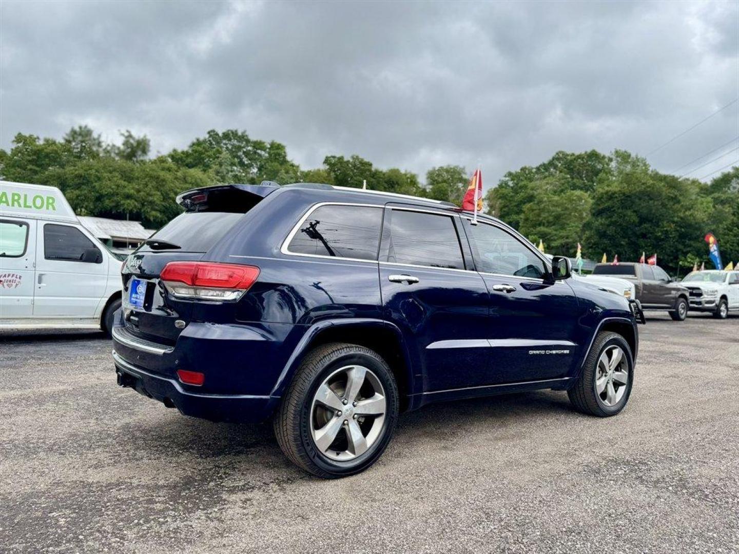 2014 Blue /Black Jeep Grand Cherokee (1C4RJFCG5EC) with an 3.6l V6 MPI Dohc VVT Flex engine, Automatic transmission, located at 745 East Steele Rd., West Columbia, SC, 29170, (803) 755-9148, 33.927212, -81.148483 - Special Internet Price! 2014 Jeep Grand Cherokee with AM/FM radio, Bluetooth, Backup camera, Navigation, Cruise control, Panoramic sunroof, Leather interior, Keyless entry, Push to start, Powered windows, Powered door locks, Plus more! - Photo#5