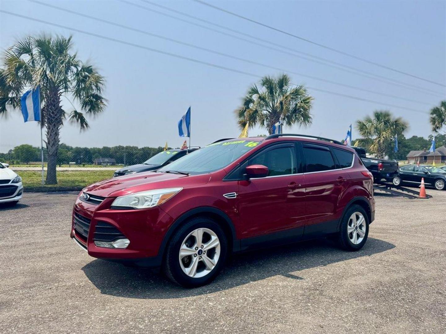 2016 Red /Taupe Ford Escape (1FMCU0GX3GU) with an 1.6l I-4 DI Dohc TC Ecobt engine, Automatic transmission, located at 745 East Steele Rd., West Columbia, SC, 29170, (803) 755-9148, 33.927212, -81.148483 - Special Internet Price! 2016 Ford Escape with AM/FM radio, Bluetooth, Backup camera, Keyless entry, Cloth interior, Powered windows, Powered door locks, Plus more! - Photo#0