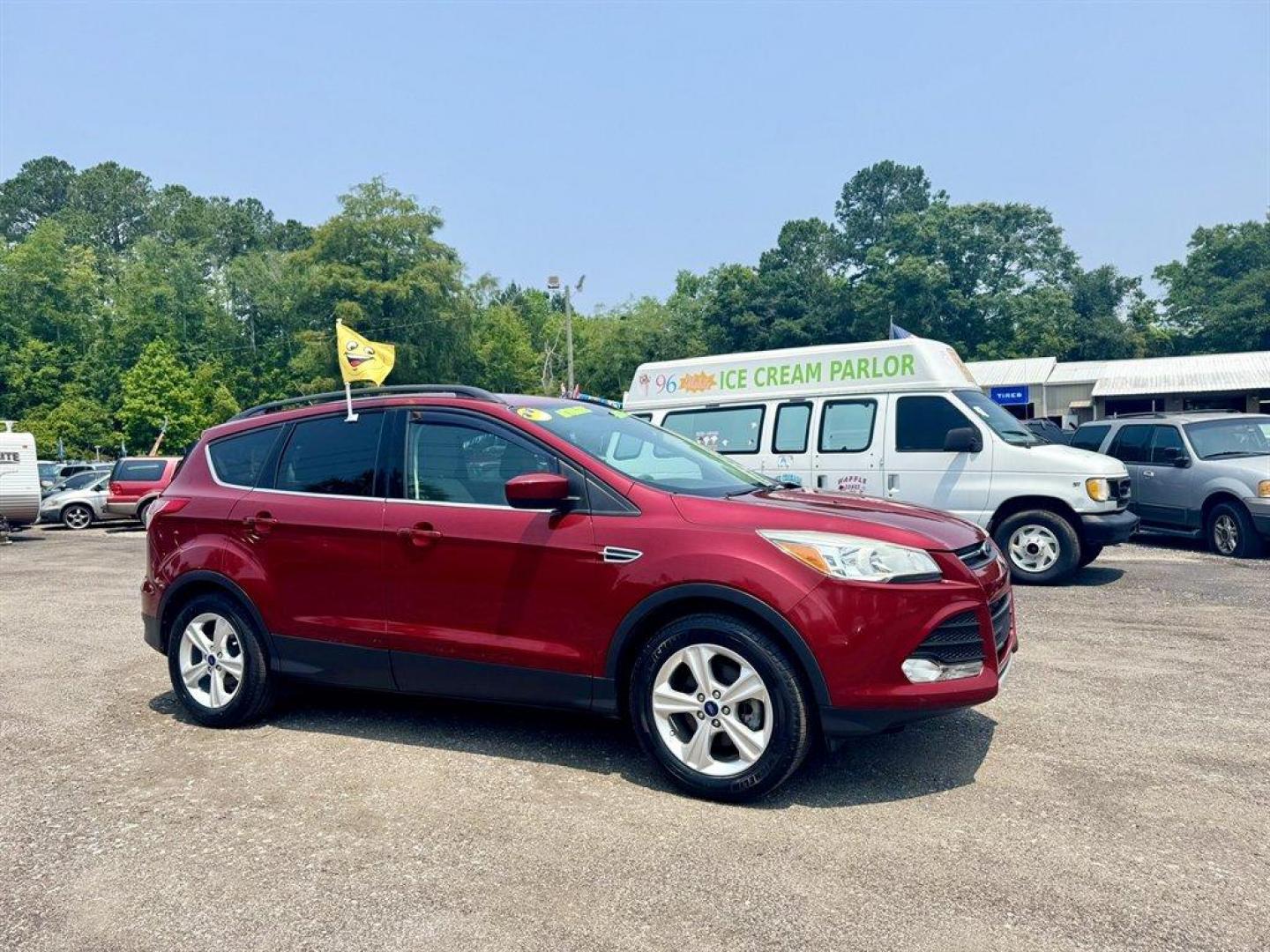 2016 Red /Taupe Ford Escape (1FMCU0GX3GU) with an 1.6l I-4 DI Dohc TC Ecobt engine, Automatic transmission, located at 745 East Steele Rd., West Columbia, SC, 29170, (803) 755-9148, 33.927212, -81.148483 - Special Internet Price! 2016 Ford Escape with AM/FM radio, Bluetooth, Backup camera, Keyless entry, Cloth interior, Powered windows, Powered door locks, Plus more! - Photo#2