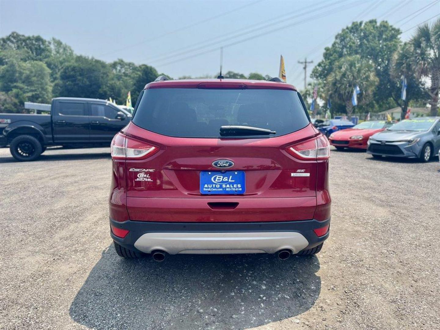 2016 Red /Taupe Ford Escape (1FMCU0GX3GU) with an 1.6l I-4 DI Dohc TC Ecobt engine, Automatic transmission, located at 745 East Steele Rd., West Columbia, SC, 29170, (803) 755-9148, 33.927212, -81.148483 - Special Internet Price! 2016 Ford Escape with AM/FM radio, Bluetooth, Backup camera, Keyless entry, Cloth interior, Powered windows, Powered door locks, Plus more! - Photo#4
