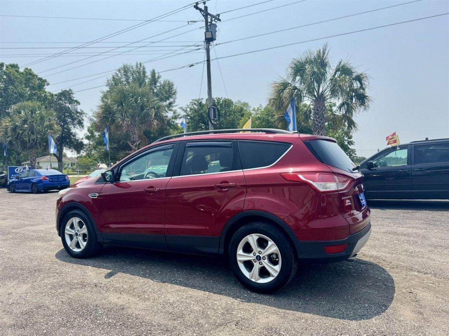 2016 Red /Taupe Ford Escape (1FMCU0GX3GU) with an 1.6l I-4 DI Dohc TC Ecobt engine, Automatic transmission, located at 745 East Steele Rd., West Columbia, SC, 29170, (803) 755-9148, 33.927212, -81.148483 - Special Internet Price! 2016 Ford Escape with AM/FM radio, Bluetooth, Backup camera, Keyless entry, Cloth interior, Powered windows, Powered door locks, Plus more! - Photo#5
