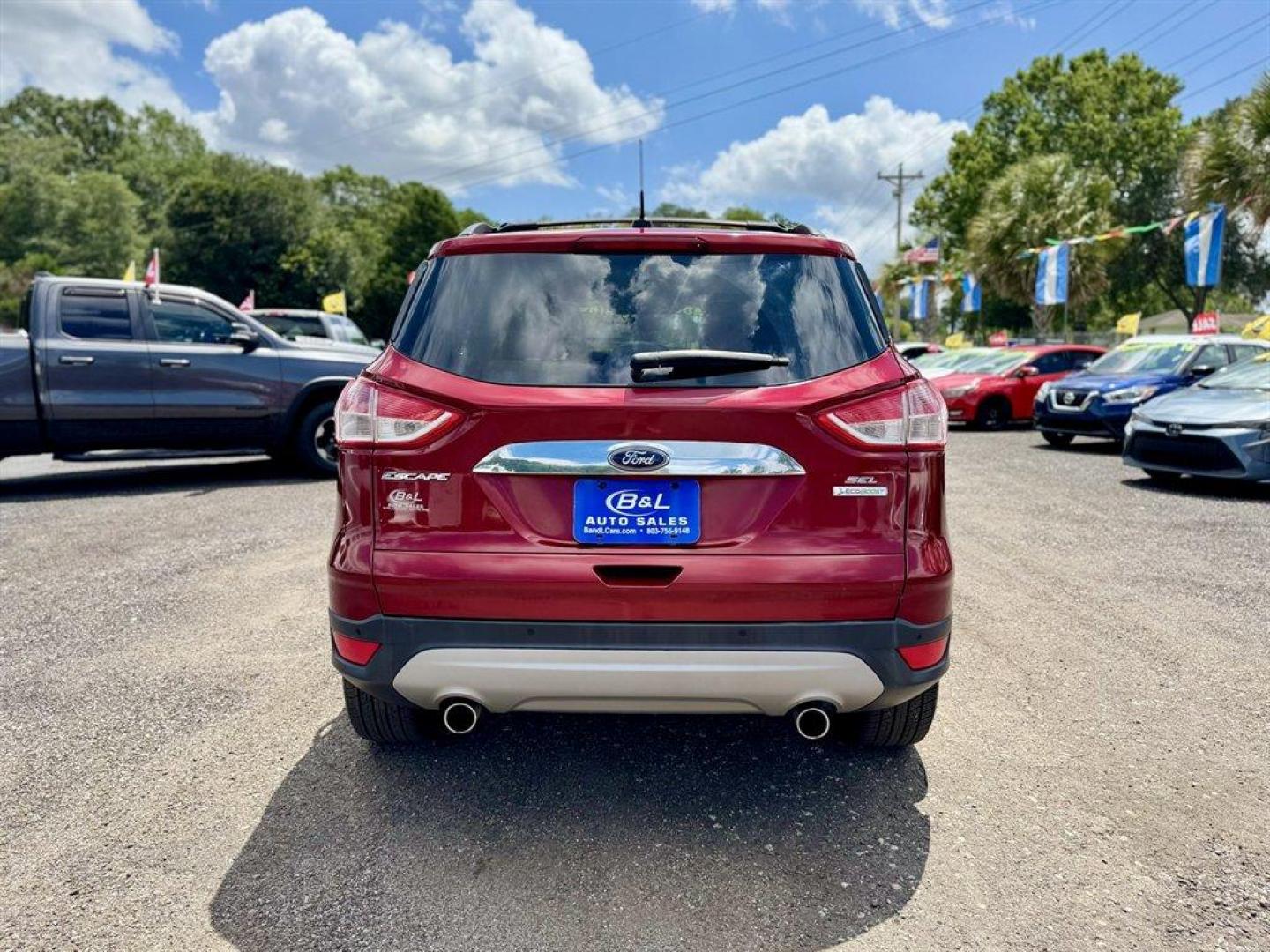 2013 Burgundy /Taupe Ford Escape (1FMCU0HX5DU) with an 1.6l I-4 DI Dohc TC Ecobt engine, Automatic transmission, located at 745 East Steele Rd., West Columbia, SC, 29170, (803) 755-9148, 33.927212, -81.148483 - Special Internet Price! 2013 Ford Escape with AM/FM radio, Navigation, Cruise control, Push to start, Keyless entry, Leather interior, Powered liftgate, Powered windows, Powered door locks, Plus more! - Photo#4