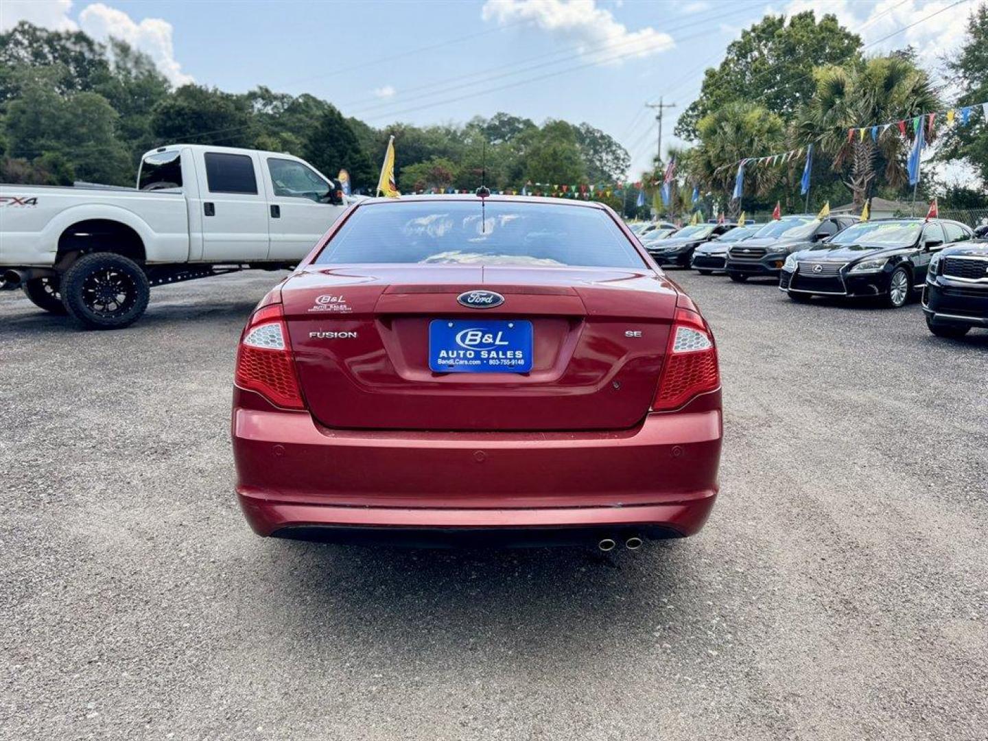 2010 Red /Black Ford Fusion (3FAHP0HAXAR) with an 2.5l I-4 Smpi Dohc 2.5l engine, Automatic transmission, located at 745 East Steele Rd., West Columbia, SC, 29170, (803) 755-9148, 33.927212, -81.148483 - Special Internet Price! 2010 Ford Fusion with AM/FM radio, Cruise control, Cloth interior, Powered windows, Powered door locks, Plus more! - Photo#4