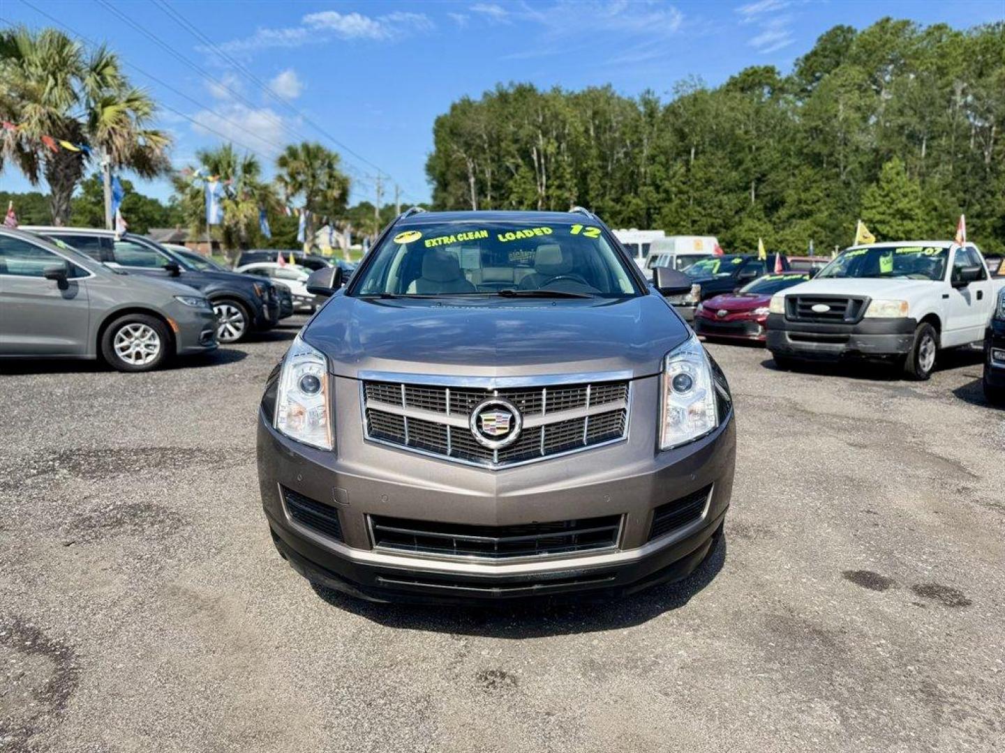 2012 Brown /Taupe Cadillac SRX (3GYFNAE35CS) with an 3.6l V6 Sidi Dohc Flex 3. engine, Automatic transmission, located at 745 East Steele Rd., West Columbia, SC, 29170, (803) 755-9148, 33.927212, -81.148483 - Special Internet Price! 2012 Cadillac SRX with AM/FM radio, Backup camera, Navigation, Panoramic sunroof, Push to start, Keyless entry, Leather interior, Powered driver seat, Powered windows, Powered door locks, Plus more! - Photo#1