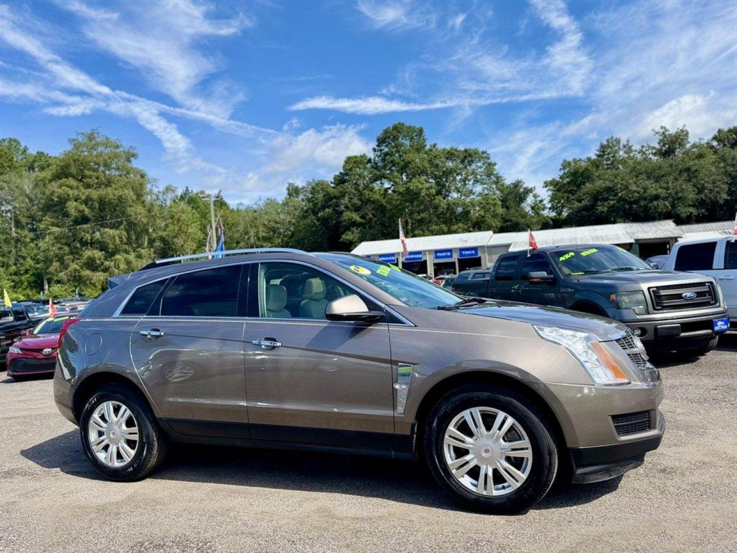 2012 Brown /Taupe Cadillac SRX (3GYFNAE35CS) with an 3.6l V6 Sidi Dohc Flex 3. engine, Automatic transmission, located at 745 East Steele Rd., West Columbia, SC, 29170, (803) 755-9148, 33.927212, -81.148483 - Special Internet Price! 2012 Cadillac SRX with AM/FM radio, Backup camera, Navigation, Panoramic sunroof, Push to start, Keyless entry, Leather interior, Powered driver seat, Powered windows, Powered door locks, Plus more! - Photo#2