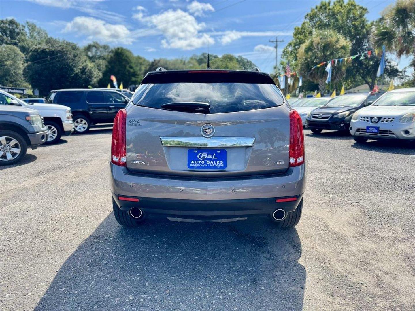 2012 Brown /Taupe Cadillac SRX (3GYFNAE35CS) with an 3.6l V6 Sidi Dohc Flex 3. engine, Automatic transmission, located at 745 East Steele Rd., West Columbia, SC, 29170, (803) 755-9148, 33.927212, -81.148483 - Special Internet Price! 2012 Cadillac SRX with AM/FM radio, Backup camera, Navigation, Panoramic sunroof, Push to start, Keyless entry, Leather interior, Powered driver seat, Powered windows, Powered door locks, Plus more! - Photo#4
