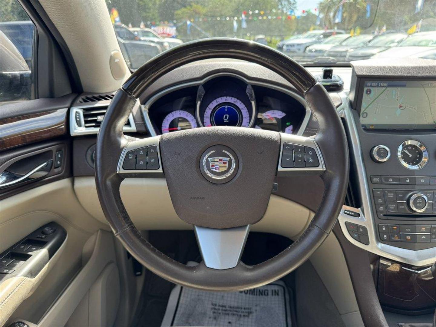 2012 Brown /Taupe Cadillac SRX (3GYFNAE35CS) with an 3.6l V6 Sidi Dohc Flex 3. engine, Automatic transmission, located at 745 East Steele Rd., West Columbia, SC, 29170, (803) 755-9148, 33.927212, -81.148483 - Special Internet Price! 2012 Cadillac SRX with AM/FM radio, Backup camera, Navigation, Panoramic sunroof, Push to start, Keyless entry, Leather interior, Powered driver seat, Powered windows, Powered door locks, Plus more! - Photo#7