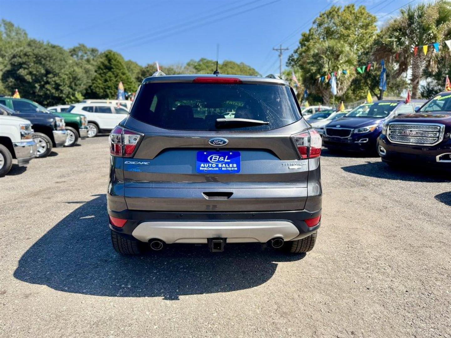 2017 Grey /Black Ford Escape (1FMCU9J99HU) with an 2.0l I-4 DI T/C Ecoboost engine, Automatic transmission, located at 745 East Steele Rd., West Columbia, SC, 29170, (803) 755-9148, 33.927212, -81.148483 - Special Internet Price! 2017 Ford Escape - Photo#4