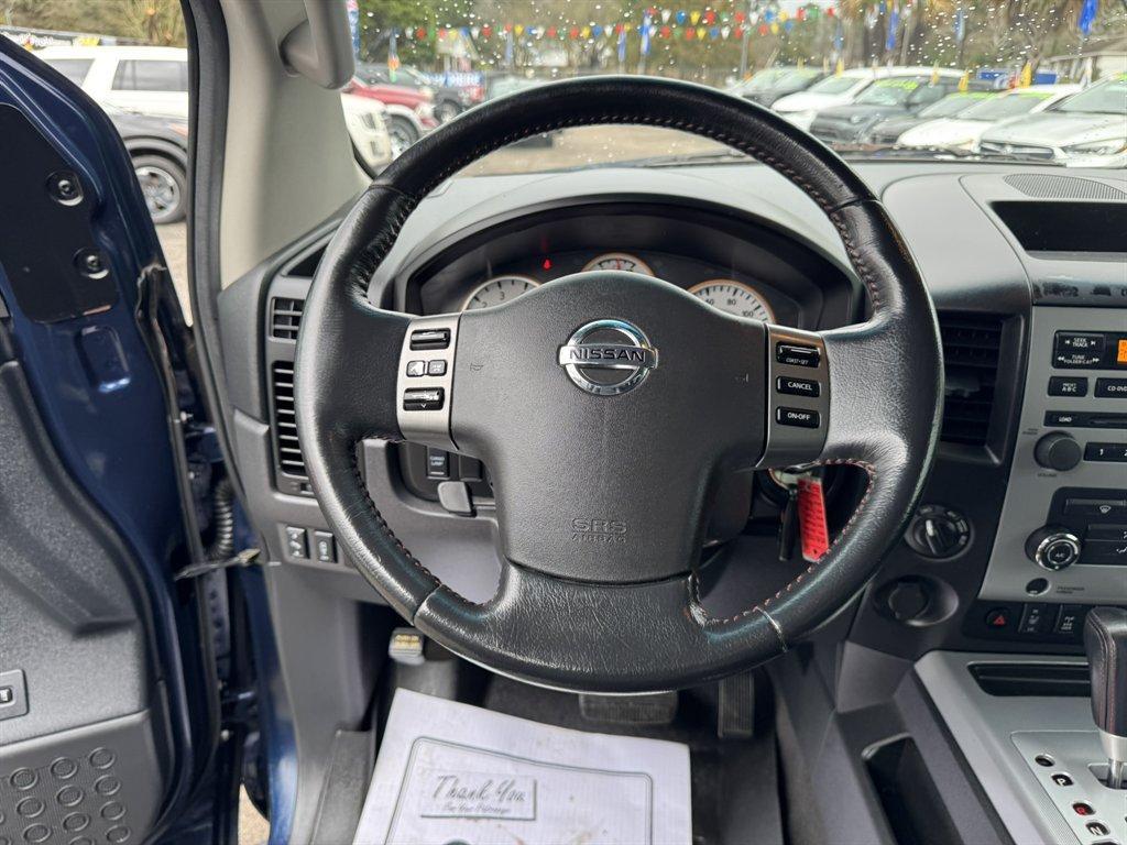 2012 Blue /Black Nissan Titan (1N6BA0ECXCN) with an 5.6l V8 MPI Dohc Flex 5.6 engine, Automatic transmission, located at 745 East Steele Rd., West Columbia, SC, 29170, (803) 755-9148, 33.927212, -81.148483 - Photo#7