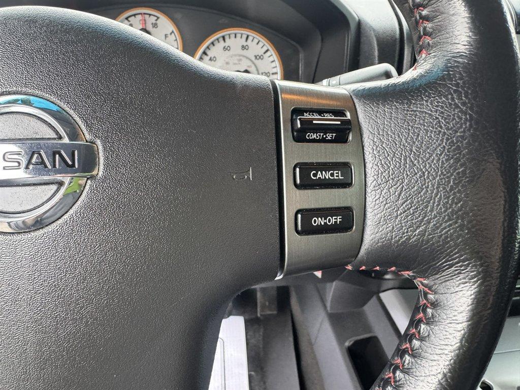 2012 Blue /Black Nissan Titan (1N6BA0ECXCN) with an 5.6l V8 MPI Dohc Flex 5.6 engine, Automatic transmission, located at 745 East Steele Rd., West Columbia, SC, 29170, (803) 755-9148, 33.927212, -81.148483 - Photo#9