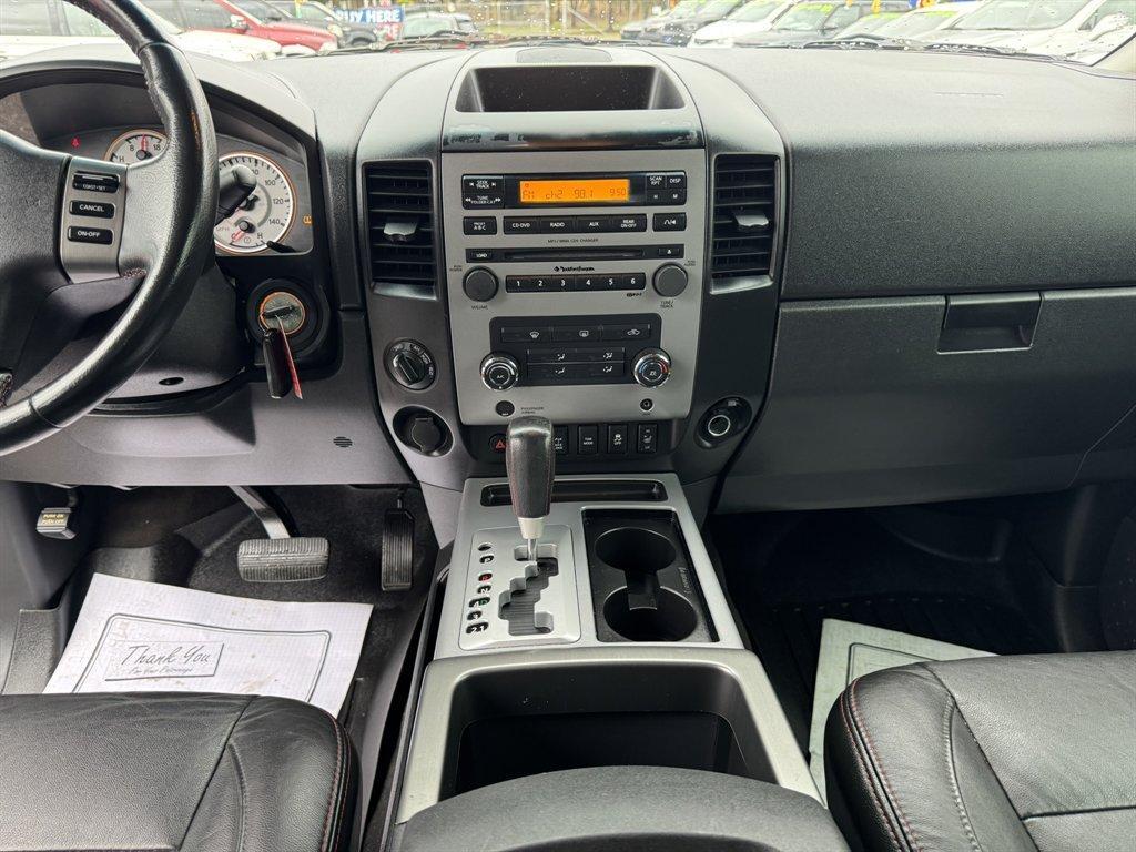 2012 Blue /Black Nissan Titan (1N6BA0ECXCN) with an 5.6l V8 MPI Dohc Flex 5.6 engine, Automatic transmission, located at 745 East Steele Rd., West Columbia, SC, 29170, (803) 755-9148, 33.927212, -81.148483 - Photo#11