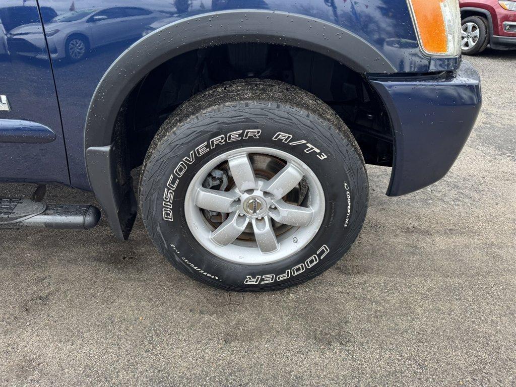 2012 Blue /Black Nissan Titan (1N6BA0ECXCN) with an 5.6l V8 MPI Dohc Flex 5.6 engine, Automatic transmission, located at 745 East Steele Rd., West Columbia, SC, 29170, (803) 755-9148, 33.927212, -81.148483 - Photo#31