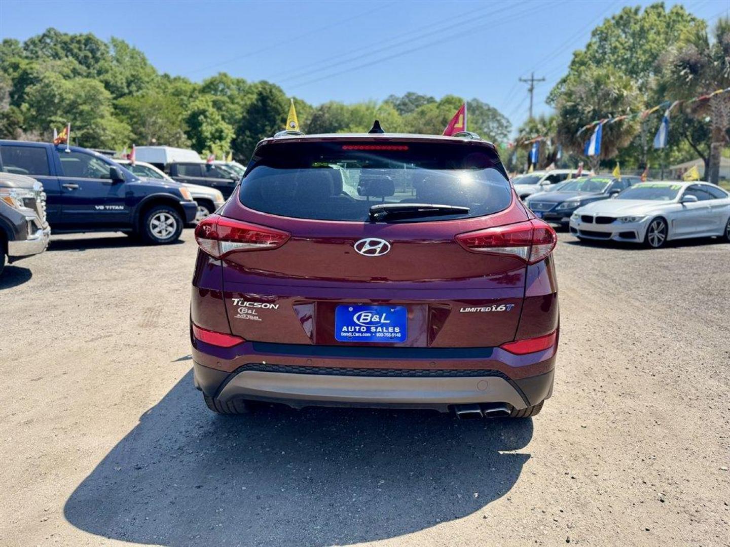 2016 Red /Grey Hyundai Tucson (KM8J33A23GU) with an 1.6l I-4 DI Dohc Cvvt T/C engine, Automatic transmission, located at 745 East Steele Rd., West Columbia, SC, 29170, (803) 755-9148, 33.927212, -81.148483 - Photo#4