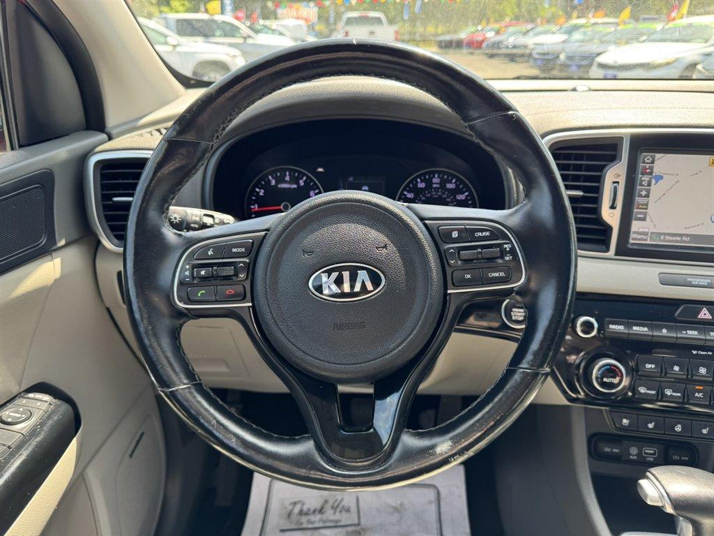2019 Red /Grey Kia Sportage (KNDPNCAC7K7) with an 2.4l I-4 DI Dohc 2.4l engine, Automatic transmission, located at 745 East Steele Rd., West Columbia, SC, 29170, (803) 755-9148, 33.927212, -81.148483 - Photo#7
