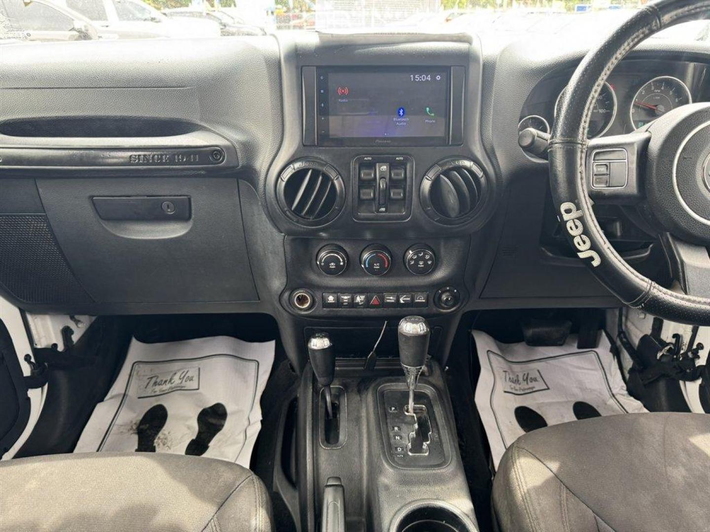 2015 White /Black Jeep Wrangler (1C4BJWKG2FL) with an 3.6l V6 MPI Dohc 3.6l engine, Automatic transmission, located at 745 East Steele Rd., West Columbia, SC, 29170, (803) 755-9148, 33.927212, -81.148483- Photo#11