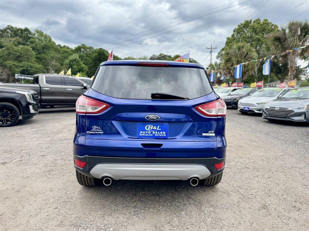 2013 Blue /Black Ford Escape (1FMCU0G97DU) with an 2.0l I-4 DI T/C Ecoboost engine, Automatic transmission, located at 745 East Steele Rd., West Columbia, SC, 29170, (803) 755-9148, 33.927212, -81.148483 - Photo#4