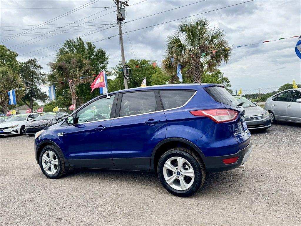 2013 Blue /Black Ford Escape (1FMCU0G97DU) with an 2.0l I-4 DI T/C Ecoboost engine, Automatic transmission, located at 745 East Steele Rd., West Columbia, SC, 29170, (803) 755-9148, 33.927212, -81.148483 - Photo#5
