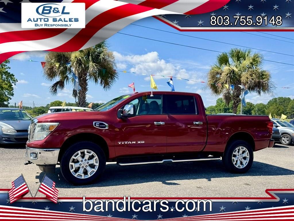 2016 Red /Black Nissan Titan XD (1N6BA1F24GN) with an 5.0l V8 DI Dohc Tdsl 5.0l engine, Automatic transmission, located at 745 East Steele Rd., West Columbia, SC, 29170, (803) 755-9148, 33.927212, -81.148483- Photo#0