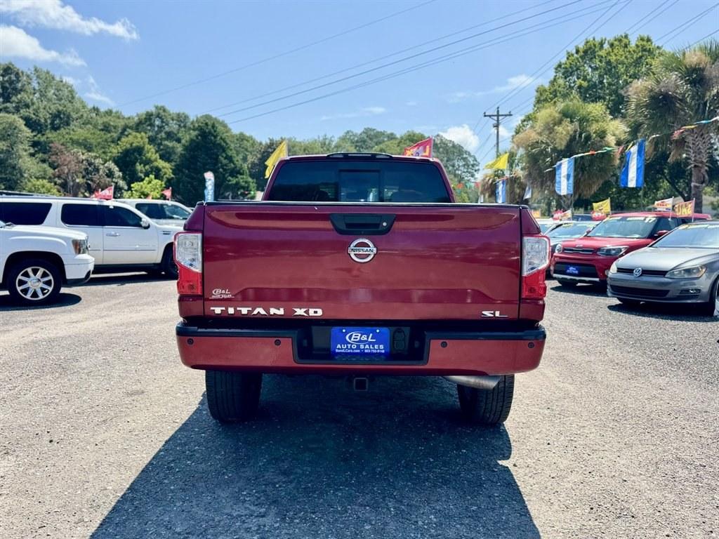 2016 Red /Black Nissan Titan XD (1N6BA1F24GN) with an 5.0l V8 DI Dohc Tdsl 5.0l engine, Automatic transmission, located at 745 East Steele Rd., West Columbia, SC, 29170, (803) 755-9148, 33.927212, -81.148483- Photo#4