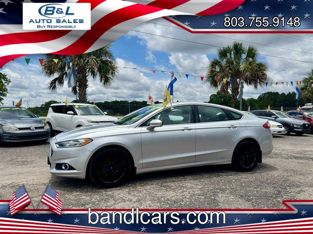 2014 Silver /Black Ford Fusion (3FA6P0HR8ER) with an 1.6l I-4 DI Dohc TC Ecobt engine, Manual transmission, located at 745 East Steele Rd., West Columbia, SC, 29170, (803) 755-9148, 33.927212, -81.148483 - Photo#0