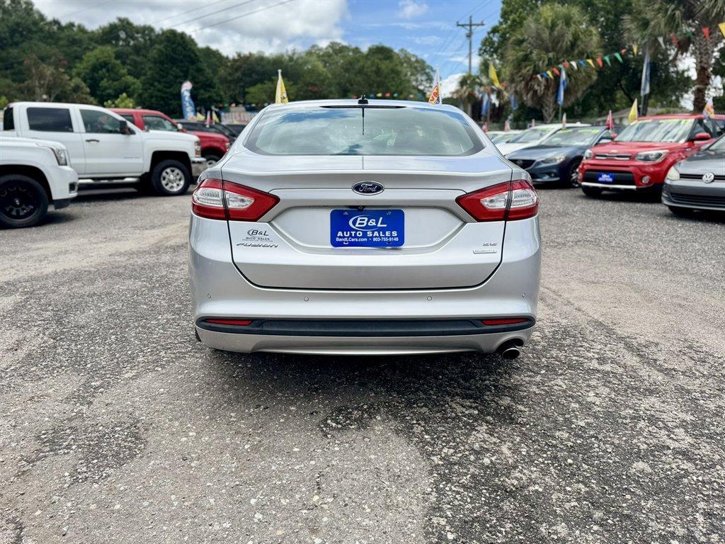 2014 Silver /Black Ford Fusion (3FA6P0HR8ER) with an 1.6l I-4 DI Dohc TC Ecobt engine, Manual transmission, located at 745 East Steele Rd., West Columbia, SC, 29170, (803) 755-9148, 33.927212, -81.148483 - Photo#4