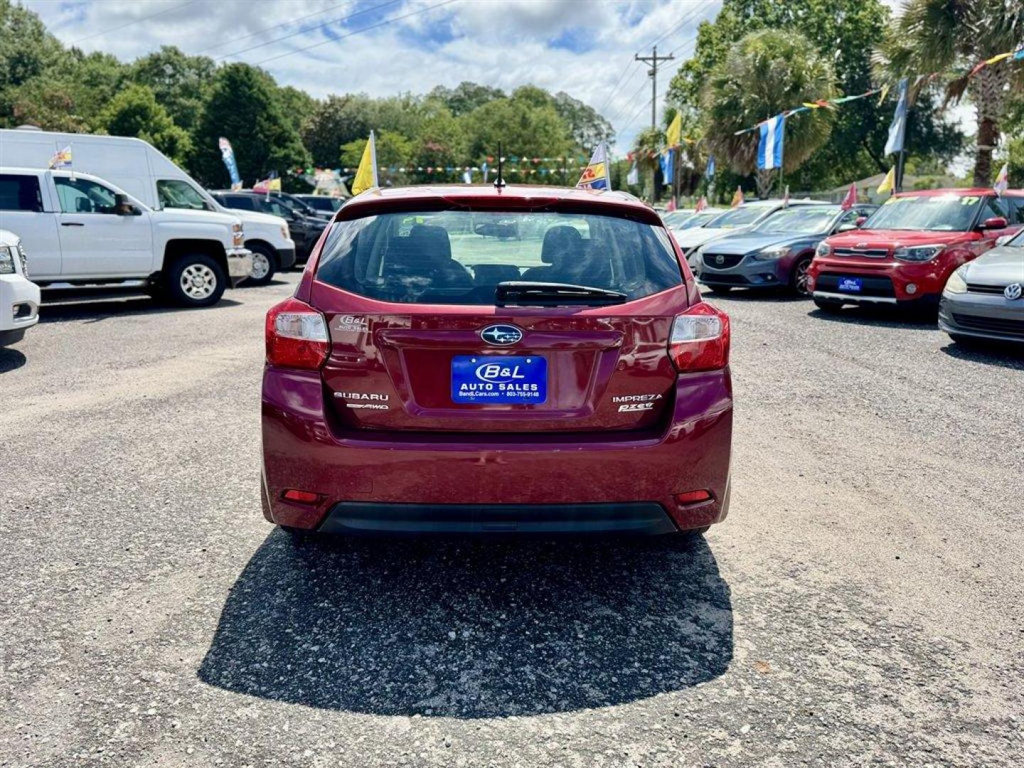 2014 Red /Black Subaru Impreza (JF1GPAD65E8) with an 2.0l H-4 Smpi Dohc 2.0l engine, Automatic transmission, located at 745 East Steele Rd., West Columbia, SC, 29170, (803) 755-9148, 33.927212, -81.148483 - Photo#4