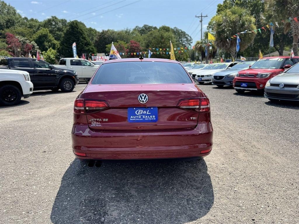 2016 Red /Black Volkswagen Jetta (3VWD67AJ0GM) with an 1.4l I-4 DI Dohc T/C 1.4l engine, Automatic transmission, located at 745 East Steele Rd., West Columbia, SC, 29170, (803) 755-9148, 33.927212, -81.148483- Photo#4