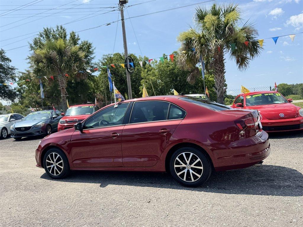 2016 Red /Black Volkswagen Jetta (3VWD67AJ0GM) with an 1.4l I-4 DI Dohc T/C 1.4l engine, Automatic transmission, located at 745 East Steele Rd., West Columbia, SC, 29170, (803) 755-9148, 33.927212, -81.148483- Photo#5