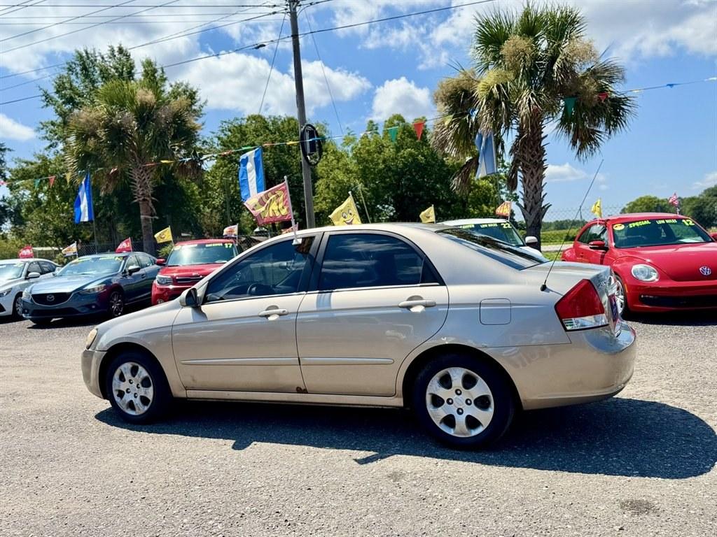 2007 Gold /Taupe Kia Spectra (KNAFE121475) with an 2.0l I-4 EFI Dohc 2.0l engine, Automatic transmission, located at 745 East Steele Rd., West Columbia, SC, 29170, (803) 755-9148, 33.927212, -81.148483- Photo#5