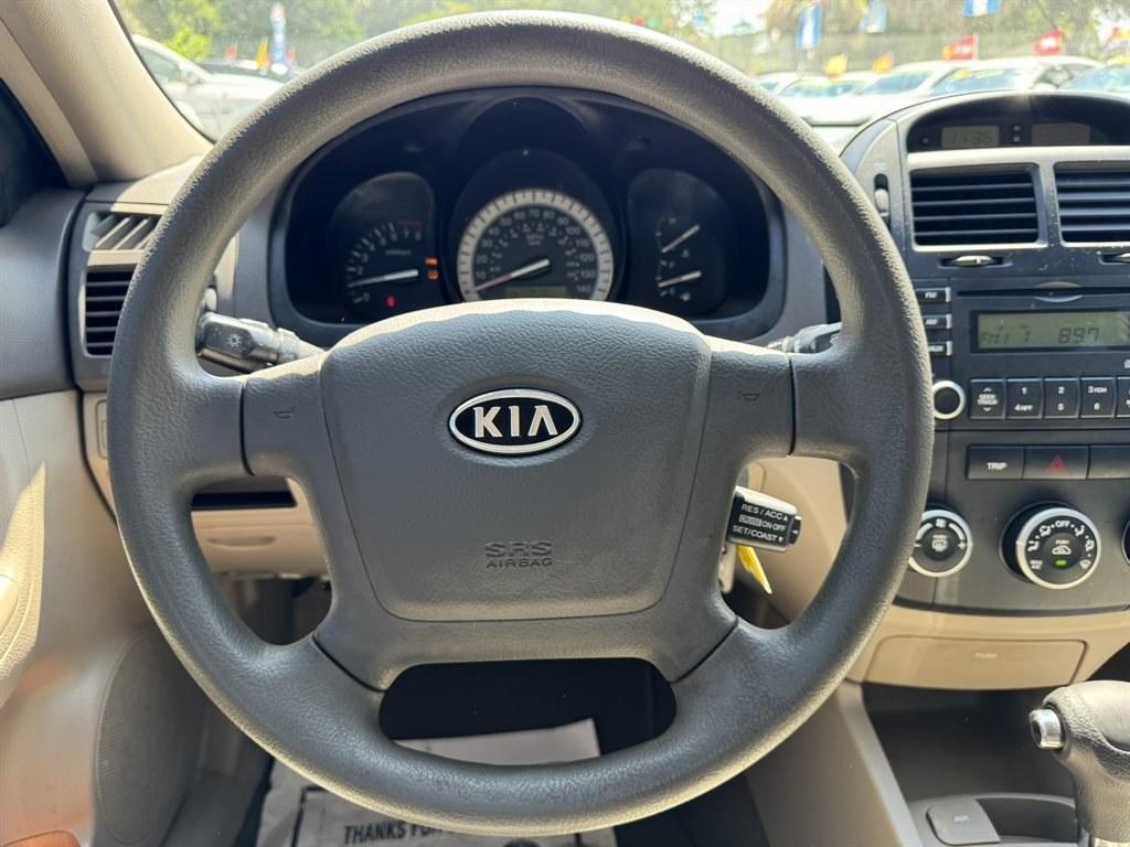 2007 Gold /Taupe Kia Spectra (KNAFE121475) with an 2.0l I-4 EFI Dohc 2.0l engine, Automatic transmission, located at 745 East Steele Rd., West Columbia, SC, 29170, (803) 755-9148, 33.927212, -81.148483- Photo#7