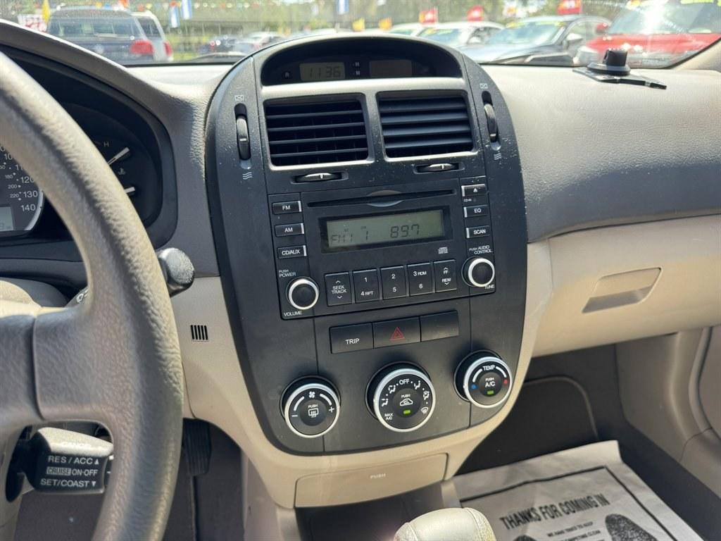 2007 Gold /Taupe Kia Spectra (KNAFE121475) with an 2.0l I-4 EFI Dohc 2.0l engine, Automatic transmission, located at 745 East Steele Rd., West Columbia, SC, 29170, (803) 755-9148, 33.927212, -81.148483- Photo#11