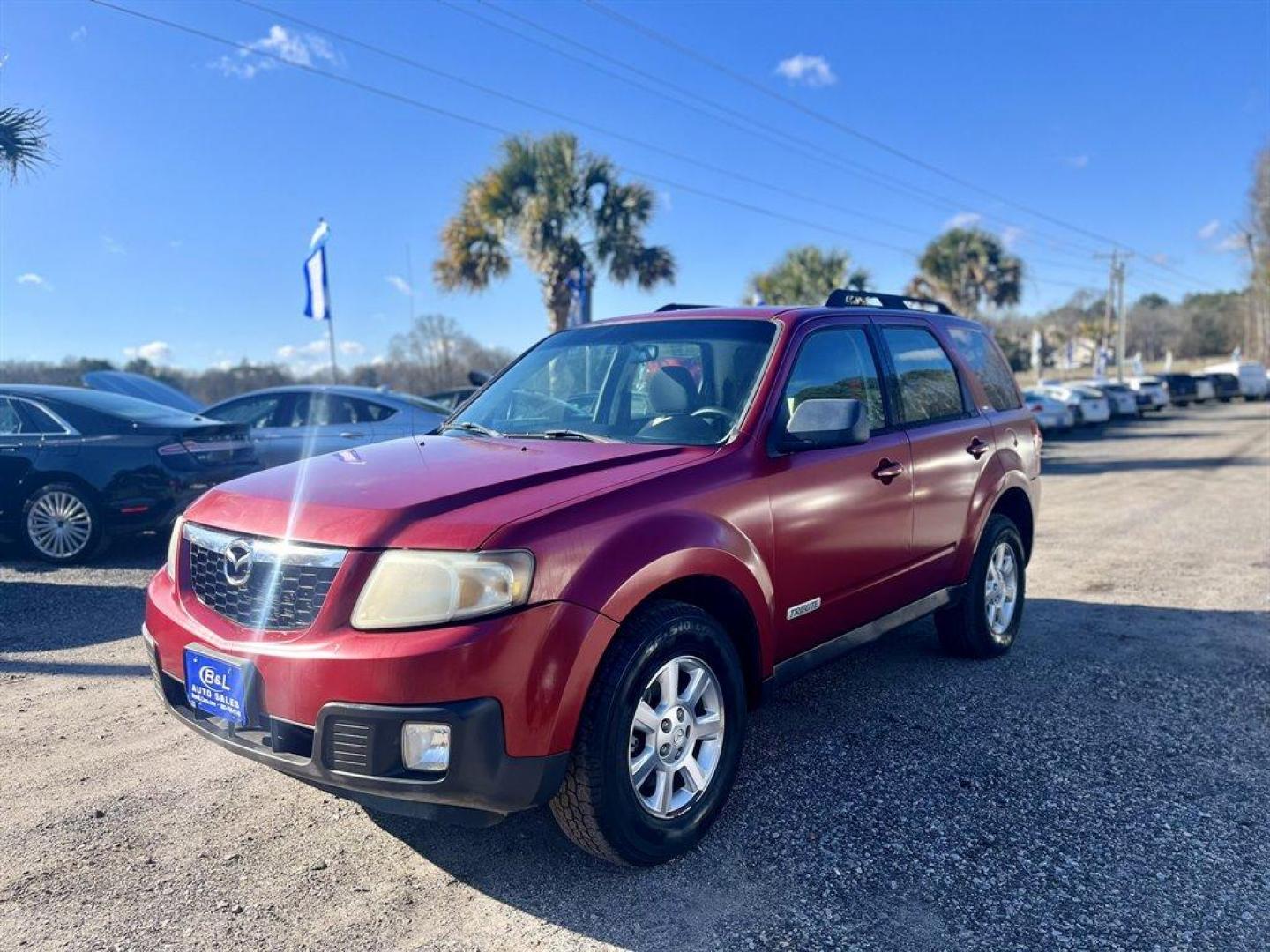 2008 Red /Tan Mazda Tribute (4F2CZ02Z38K) with an 2.3l I-4 MPI Sohc 2.3l engine, Automatic transmission, located at 745 East Steele Rd., West Columbia, SC, 29170, (803) 755-9148, 33.927212, -81.148483 - Special Internet Price! 2008 Mazda Tribute with AM/FM audio system, Cruise control, Remote keyless entry, Air conditioning, 60/40 split folding rear seat, Powered windows, Powered door locks, Flip-up liftgate window, Plus more! - Photo#0