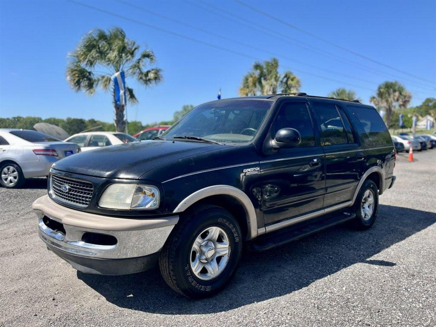 1998 Black /Tan Ford Expedition (1FMRU17L1WL) with an 5.4l V8 EFI 5.4l engine, Automatic transmission, located at 745 East Steele Rd., West Columbia, SC, 29170, (803) 755-9148, 33.927212, -81.148483 - Special Internet Price! 1998 Ford Expedition Eddie Bauer with AM/FM radio, Cruise control, Air conditioning, Leather interior, Powered driver seat, 3rd row bench seat, 2nd row bench seat, Rear air conditioning, Powered windows, Powered door locks, Plus more! - Photo#0