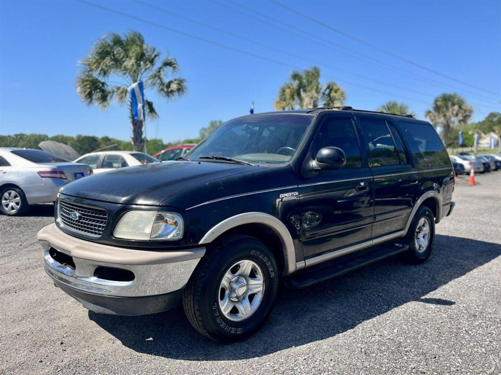 1998 Black /Tan Ford Expedition (1FMRU17L1WL) with an 5.4l V8 EFI 5.4l engine, Automatic transmission, located at 745 East Steele Rd., West Columbia, SC, 29170, (803) 755-9148, 33.927212, -81.148483 - Special Internet Price! 1998 Ford Expedition Eddie Bauer with AM/FM radio, Cruise control, Air conditioning, Leather interior, Powered driver seat, 3rd row bench seat, 2nd row bench seat, Rear air conditioning, Powered windows, Powered door locks, Plus more! - Photo #0